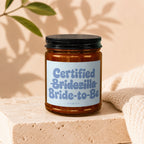 Amber jar candle with label reading "Certified Bridezilla Bride-to-Be," VOWED.