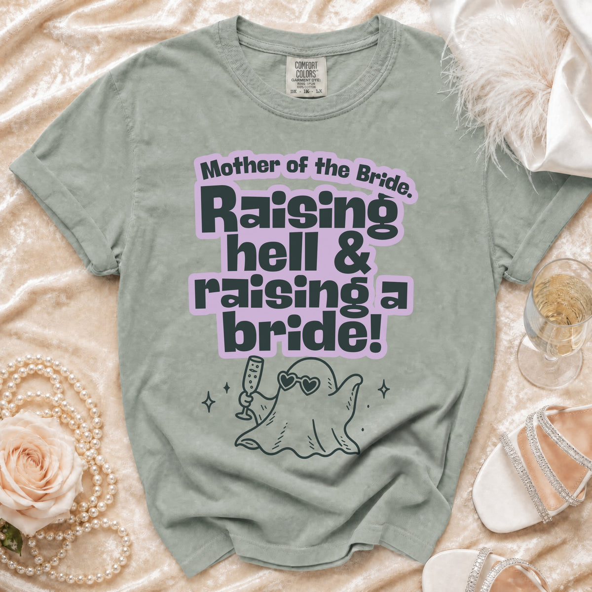 "Mother of the Bride. Raising hell & raising a bride!" text on a green t-shirt.