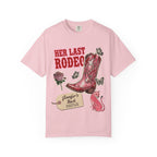 Pink t-shirt with "Her Last Rodeo" text, cowboy boot, and butterflies.
