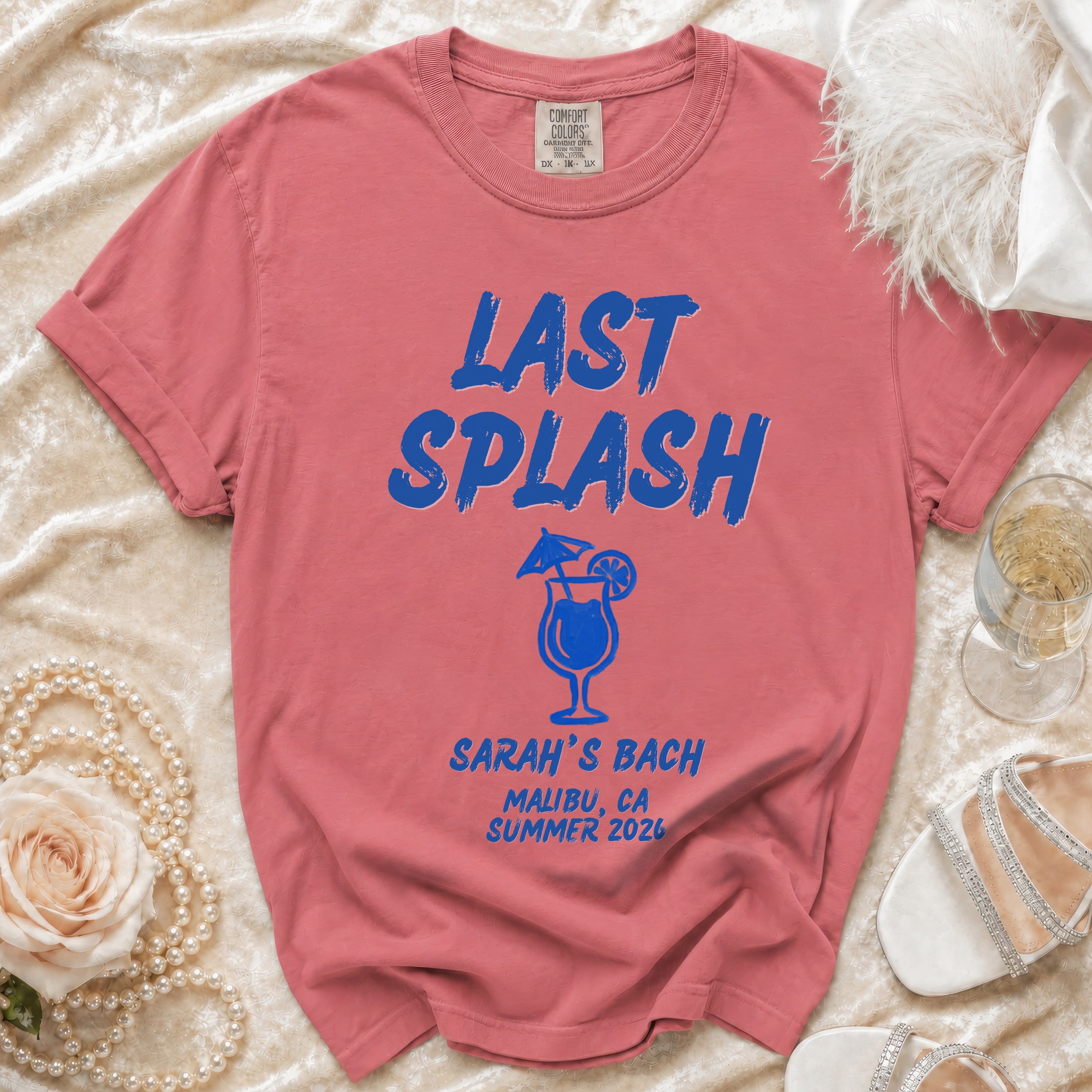 Coral t-shirt with "LAST SPLASH SARAH'S BACH MALIBU, CA SUMMER 2026" text.