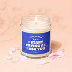 Candle with blue label reading "Light me when I start crying as I ask you."