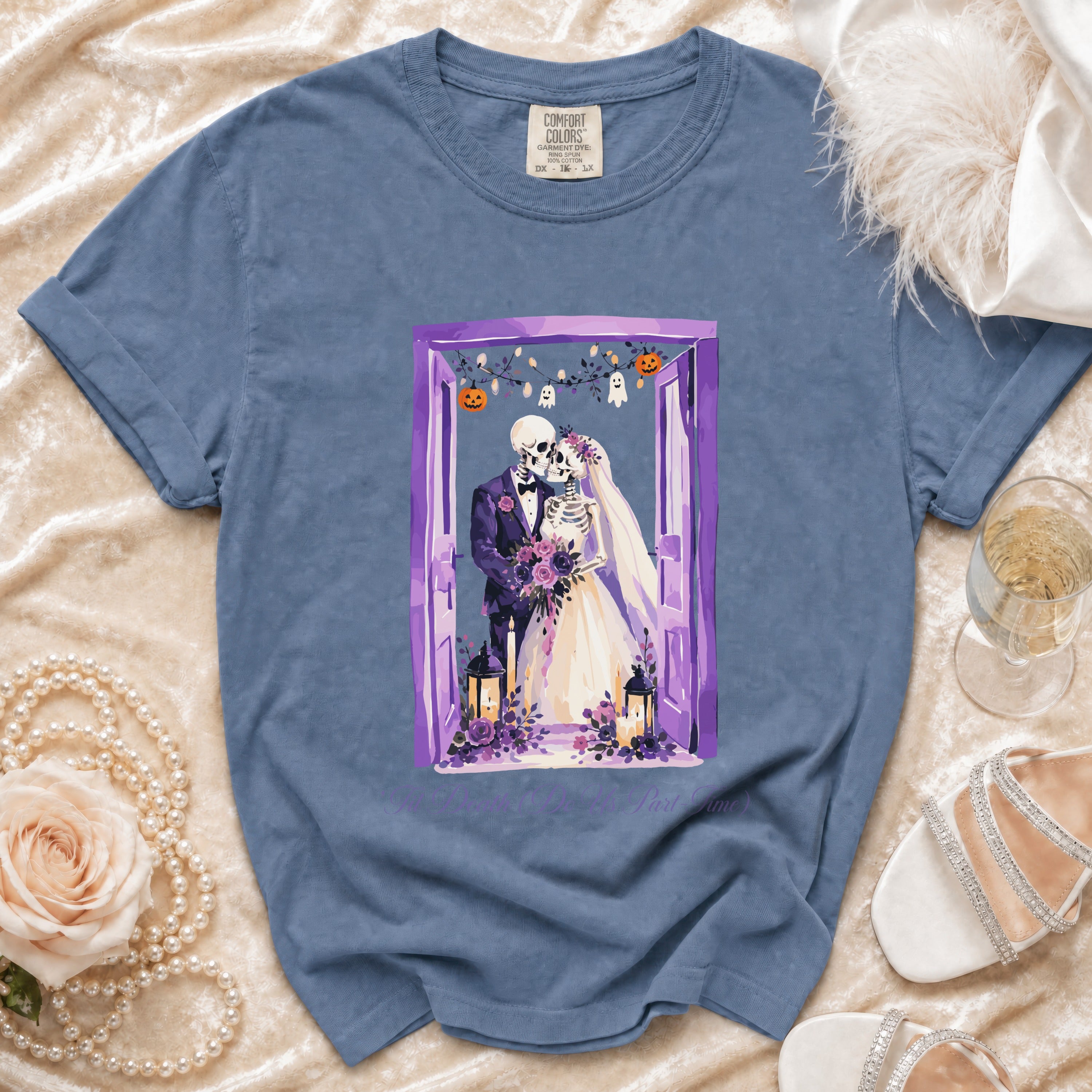 Skeleton bride and groom graphic on a blue Comfort Colors t-shirt with text.