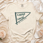 Cream t-shirt with "Camp Sarah Lake Tahoe 2026" in a pennant graphic.