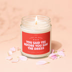 Candle with text "You Said Yes Before You Saw The Dress" surrounded by petals.