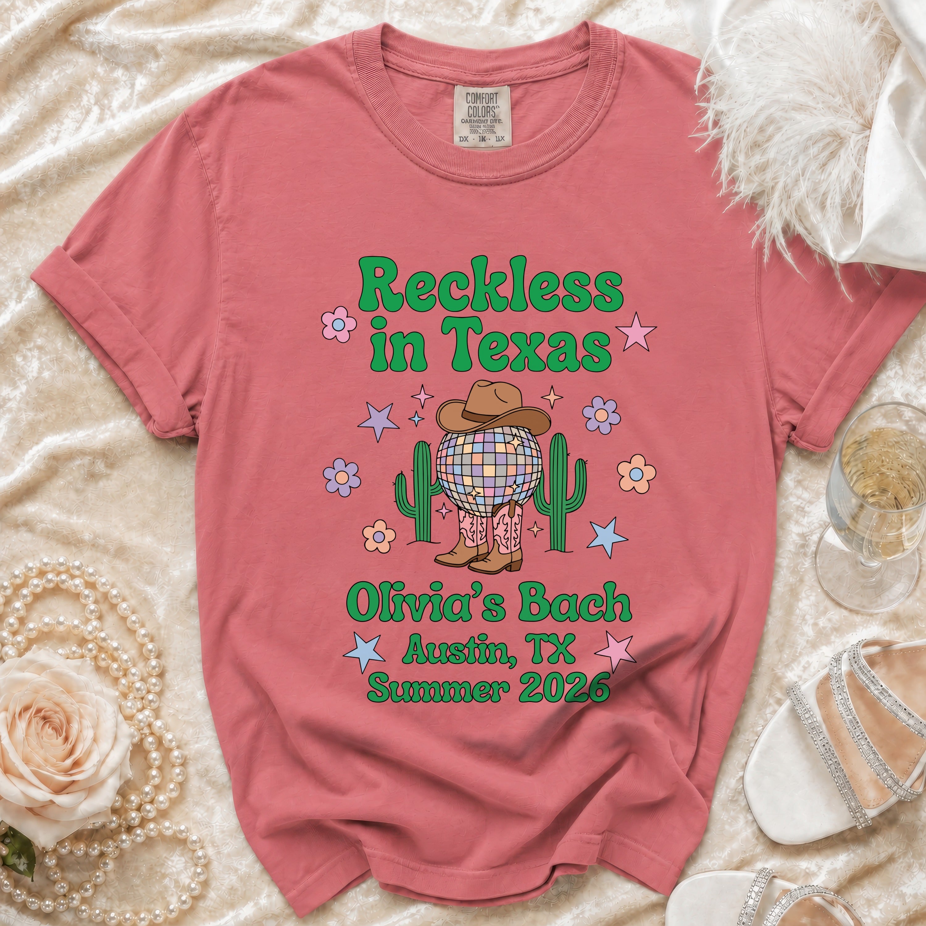 Distressed graphic tee with "Reckless in Texas Olivia's Bach Austin, TX Summer 2026" text.