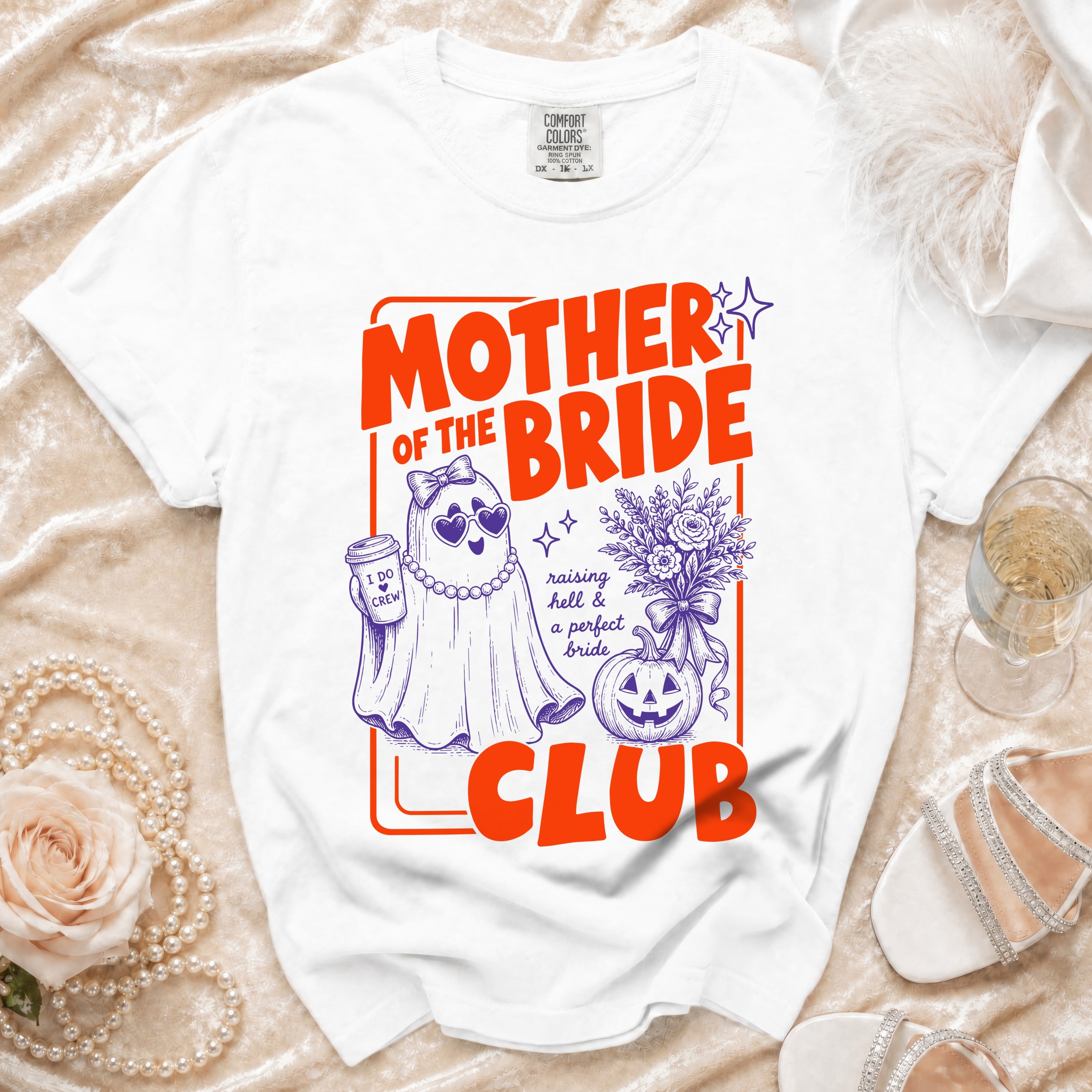 White t-shirt with "Mother of the Bride Club" graphic featuring a ghost and pumpkin.