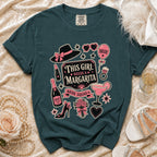 Teal t-shirt with graphic design of "This girl needs a margarita" and bridal party icons.