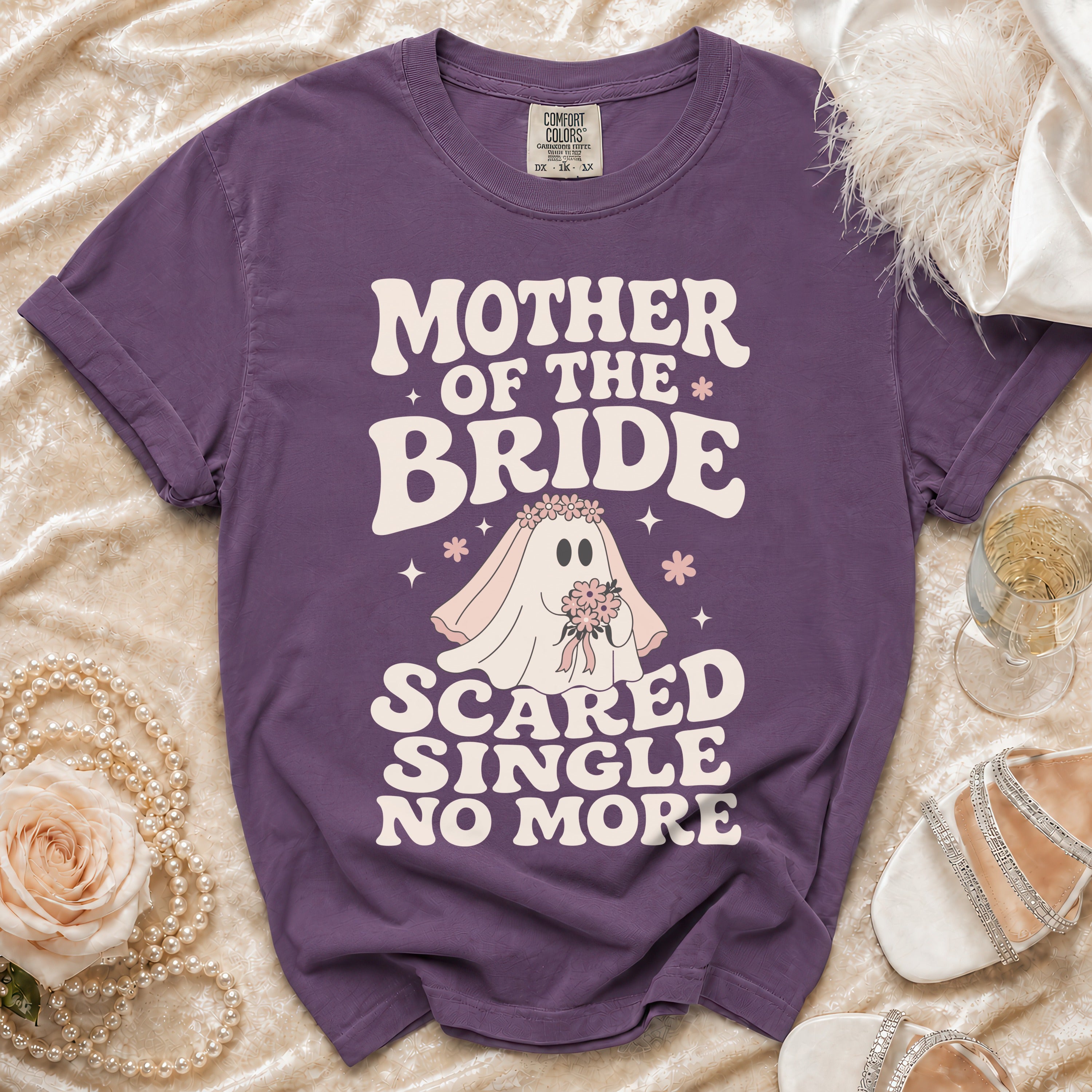 Purple t-shirt with "Mother of the Bride Scared Single No More" text and ghost graphic.