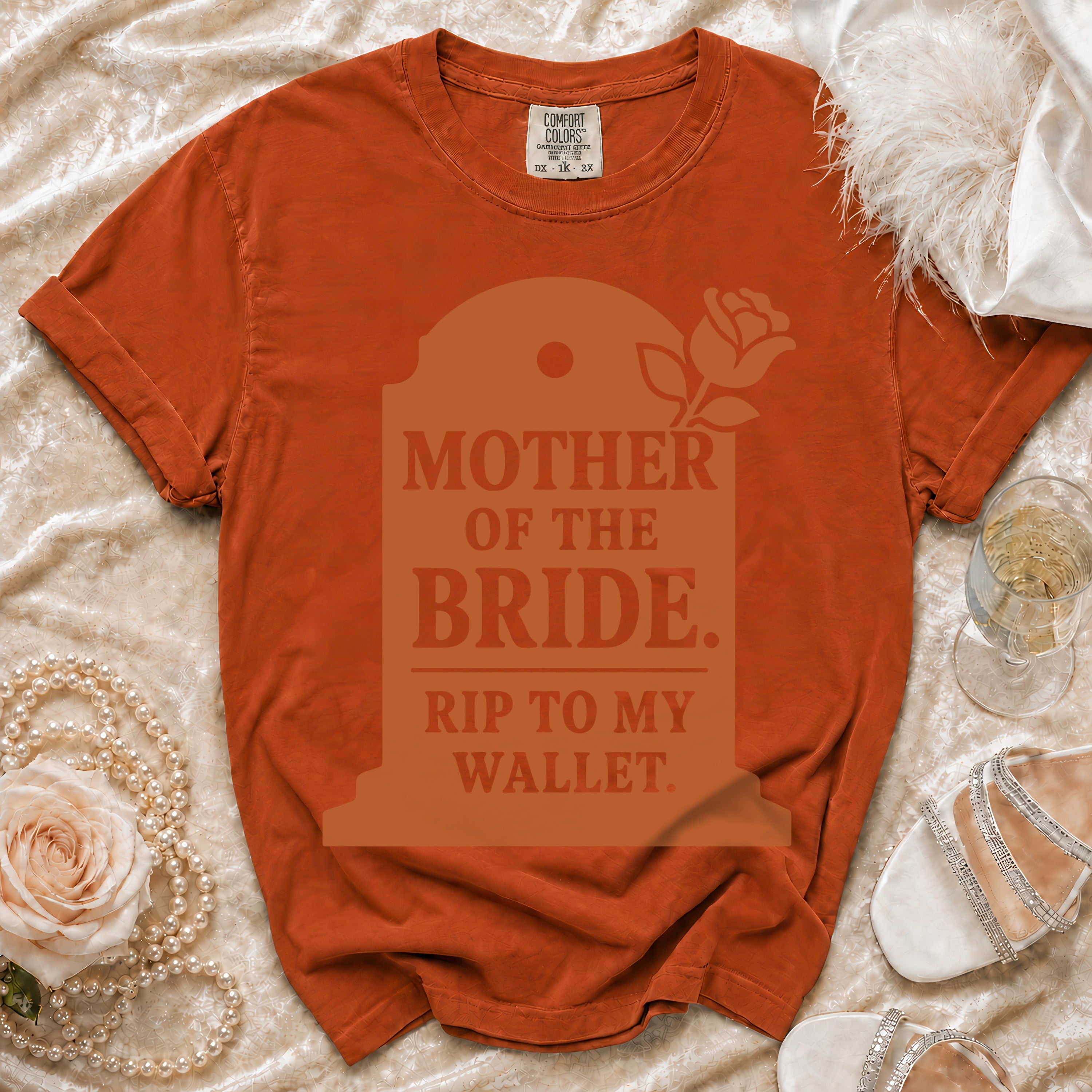 Orange t-shirt with "Mother of the Bride. Rip to my Wallet." tombstone graphic.