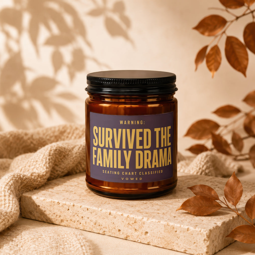 Candle labeled "Survived the family drama, seating chart classified. Vowed."