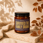 Candle labeled "Survived the family drama, seating chart classified. Vowed."