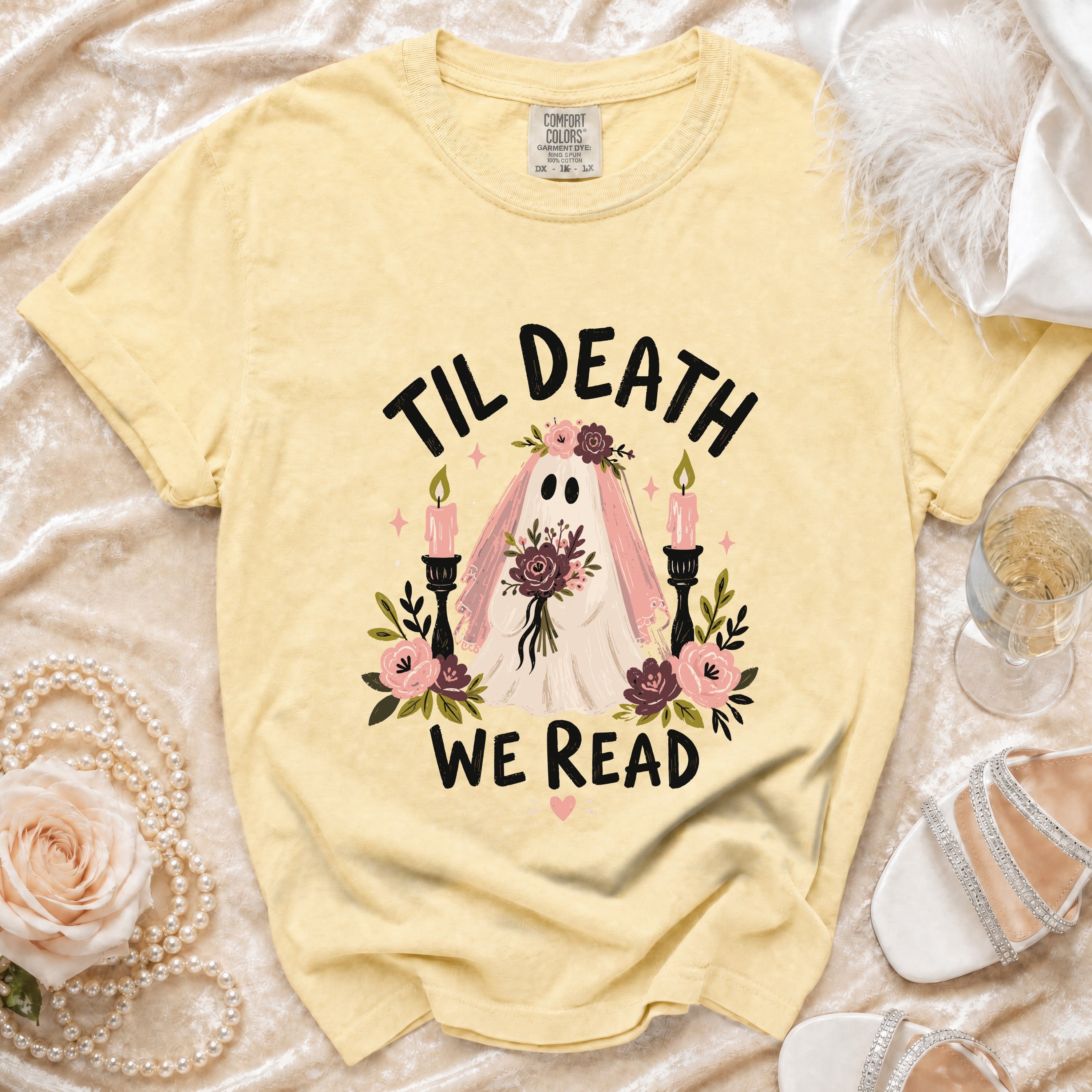 Yellow t-shirt with "Til Death We Read" text and ghost graphic.