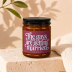 Amber jar candle with "The gays are getting married" text, "vowed" below.