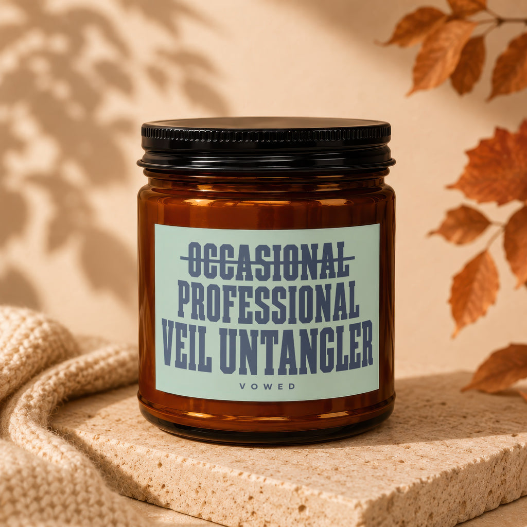 Amber jar candle with label reading "OCCASIONAL PROFESSIONAL VEIL UNTANGLER".