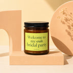 Amber candle with black lid and bright green label reading "Welcome to my cult bridal party" VOWED.