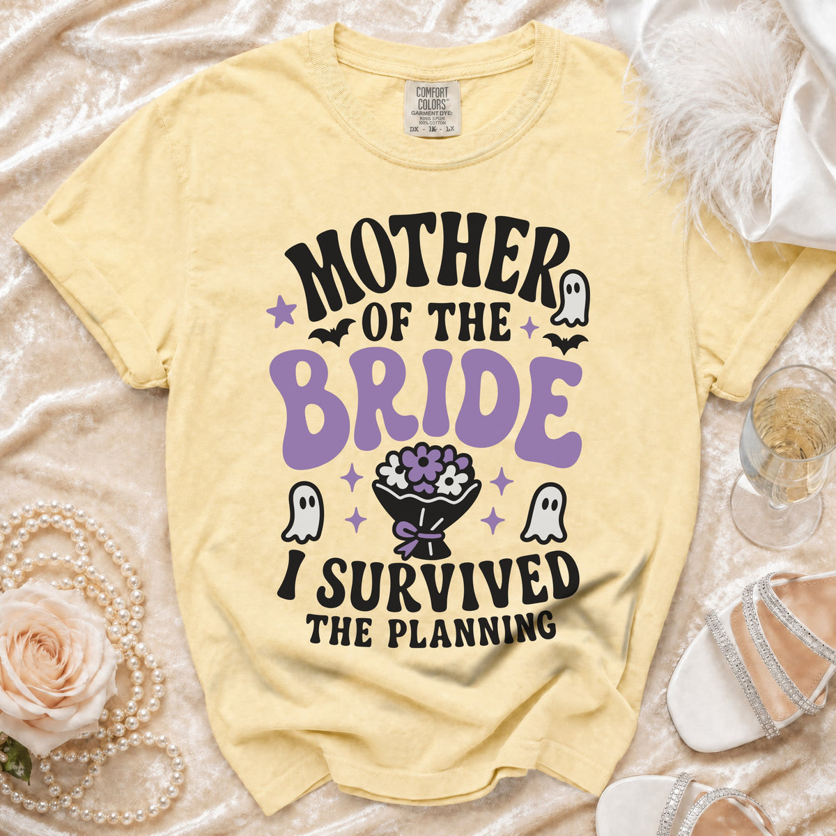 Yellow t-shirt with "Mother of the Bride I Survived The Planning" text and graphic.