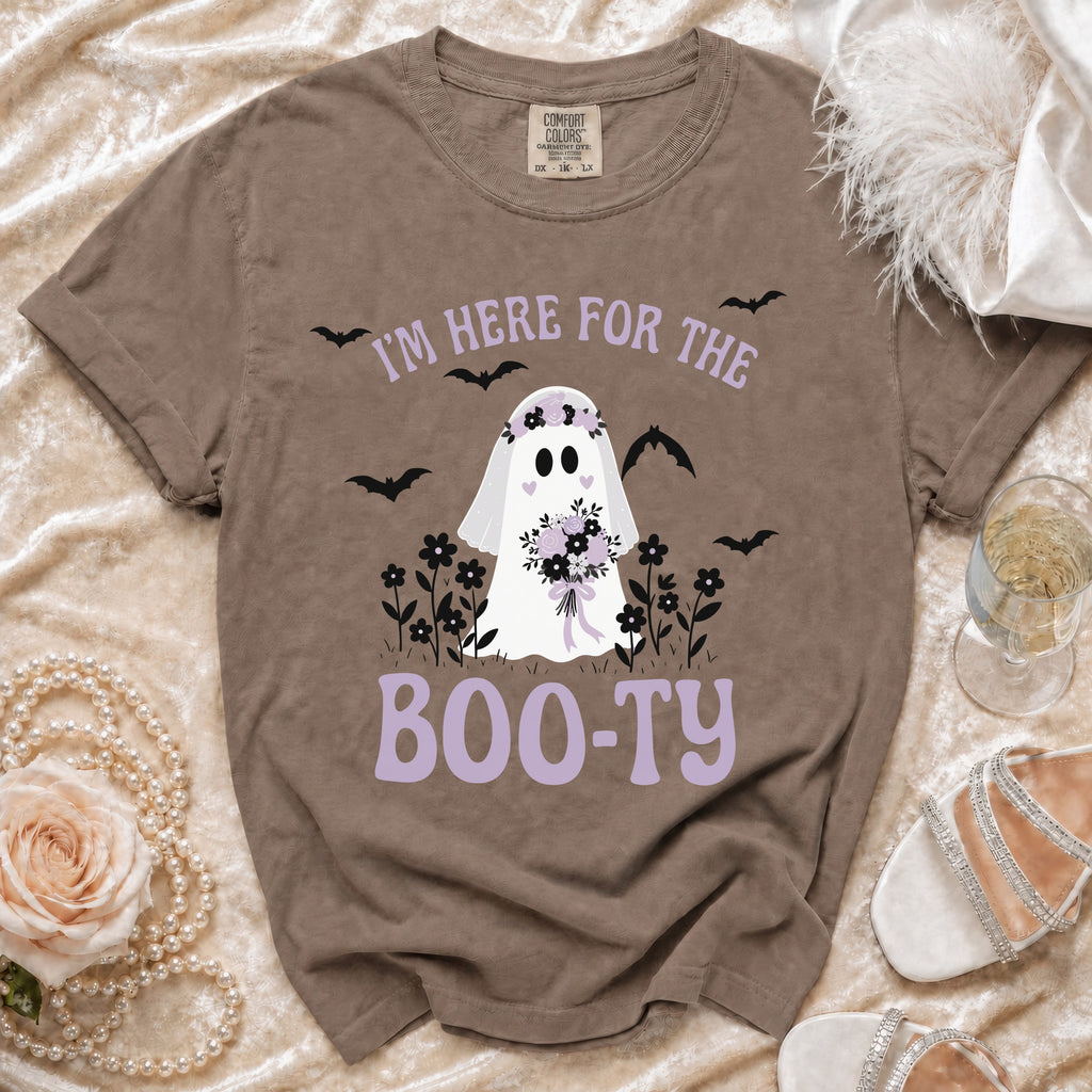 Brown t-shirt with ghost graphic saying "I'm here for the boo-ty"
