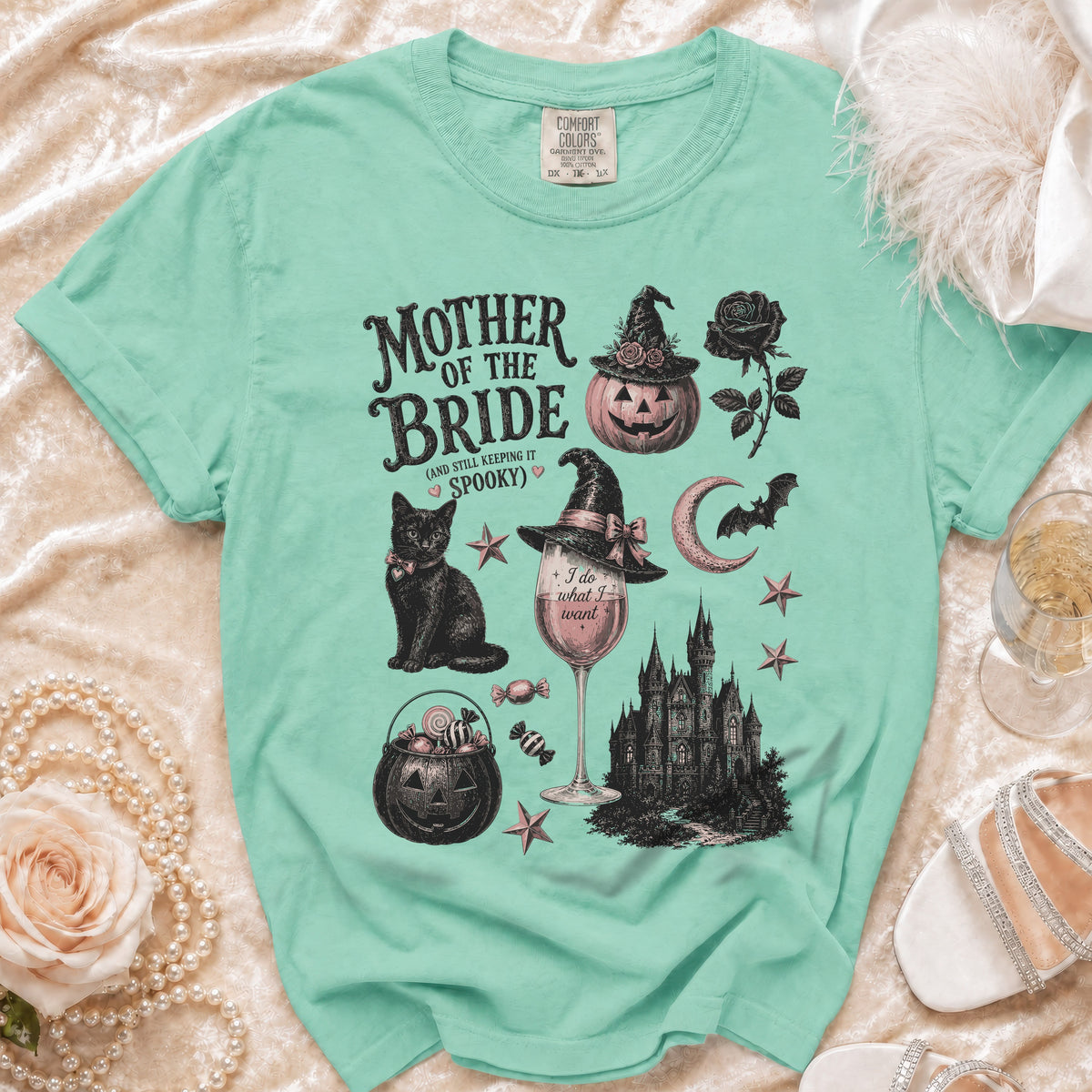 Mother of the Bride spooky graphic tee with black cat, pumpkin, and castle illustrations.