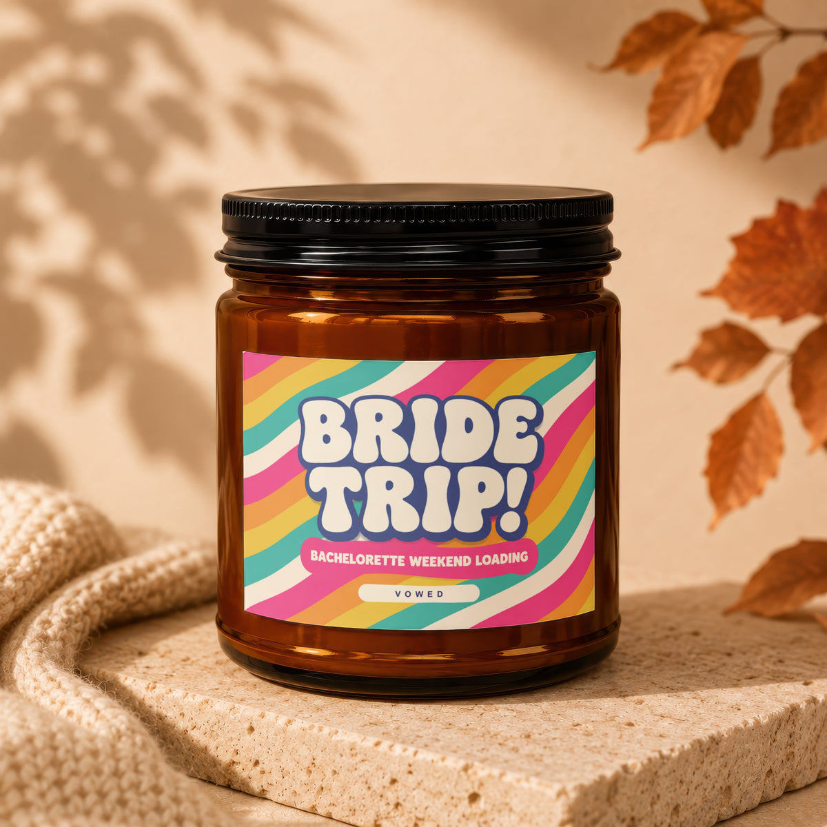 Brown glass candle with "Bride Trip! Bachelorette Weekend Loading Vowed" label.