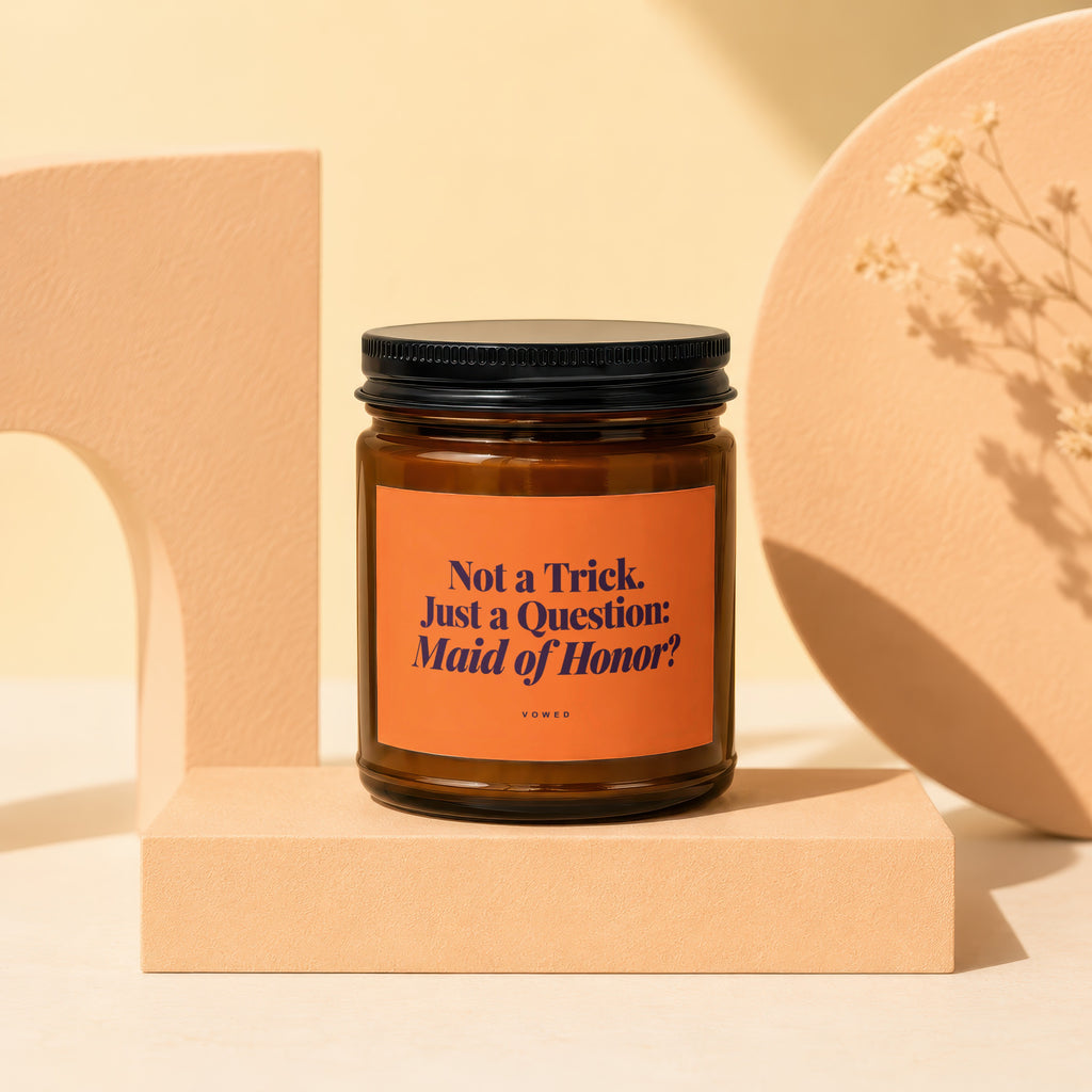 Brown glass candle with "Not a Trick. Just a Question: Maid of Honor?" text.