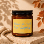 Amber jar candle with "You're Married. I'm Napping." text on yellow label.