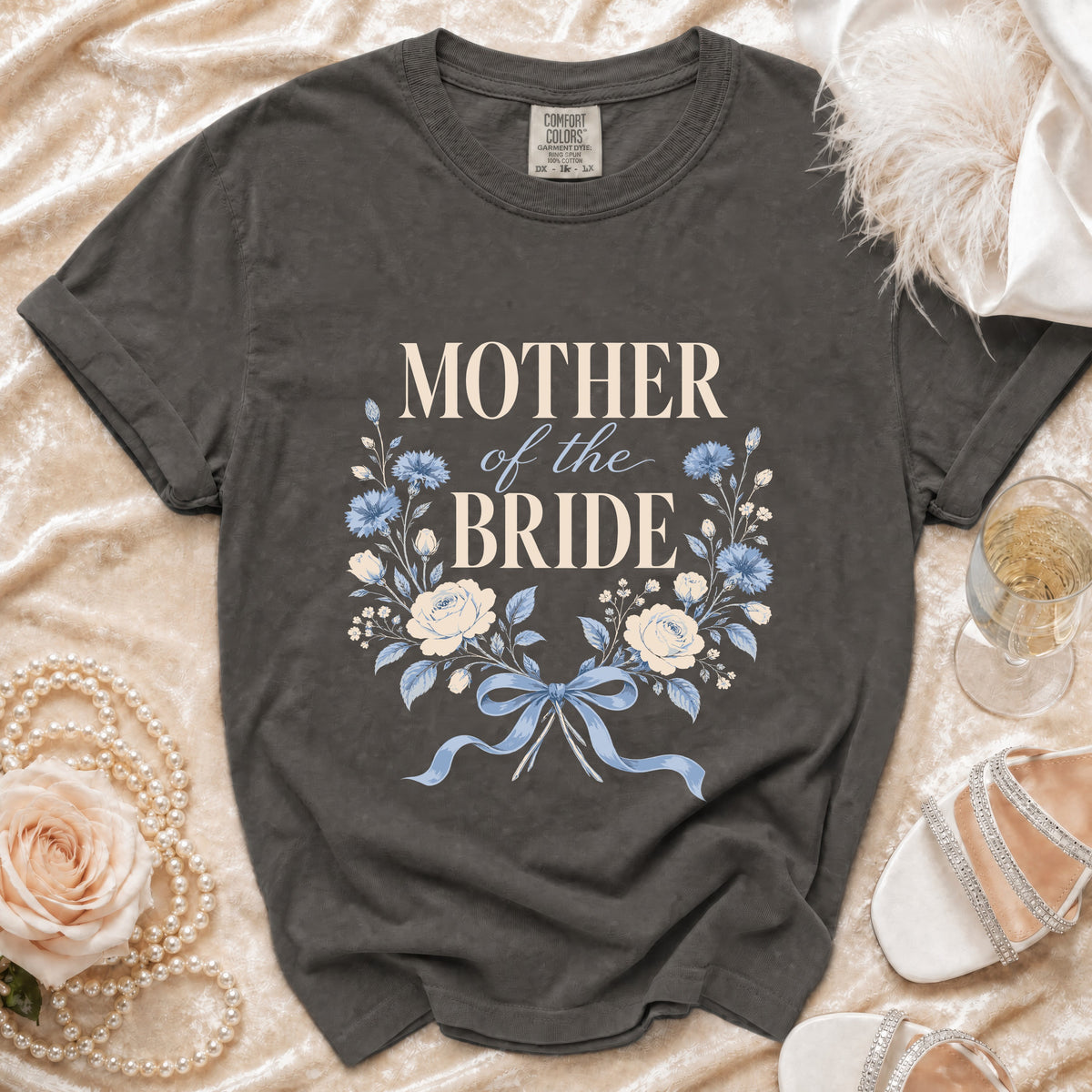 Mother of the Bride t-shirt with floral wreath and blue bow detail.
