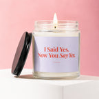Lit candle in a glass jar with lid off, label reads "I Said Yes. Now You Say Yes."