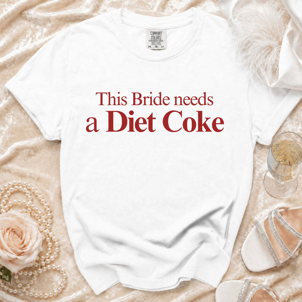 White Comfort Colors t-shirt with red text "This Bride needs a Diet Coke."