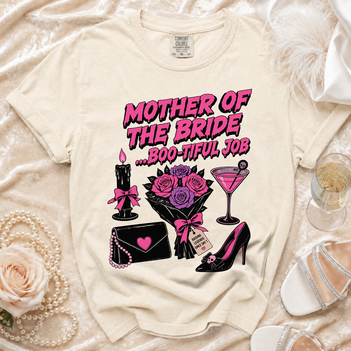 Cream t-shirt with "Mother of the Bride...Boo-tiful Job" graphic, bouquet, and accessories.