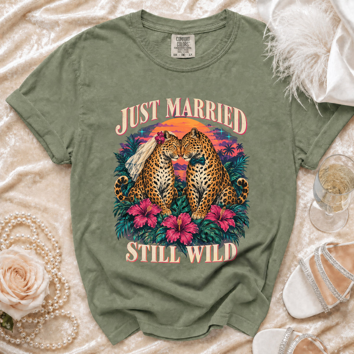 Green t-shirt with "JUST MARRIED STILL WILD" text and two leopards wearing wedding attire.