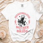 White t-shirt with "Overstimulated Mother of the Bride" text and champagne glass graphic.