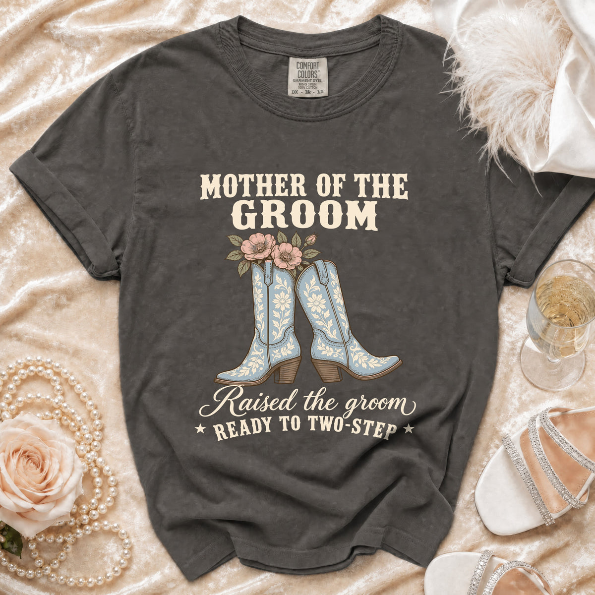 Dark grey t-shirt with "Mother of the Groom" text, cowboy boots, and flowers graphic.