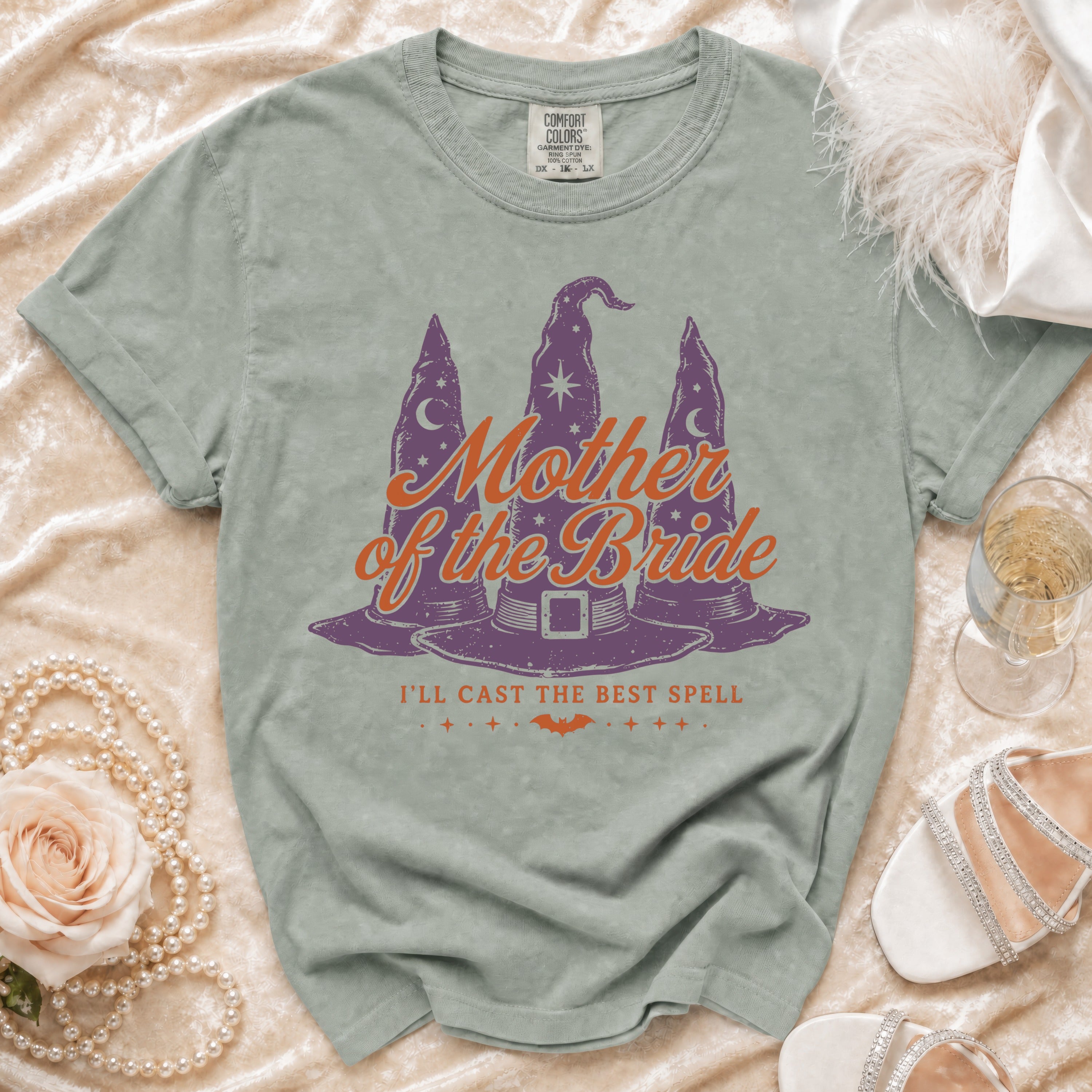 Green t-shirt with "Mother of the Bride" and witch hats.