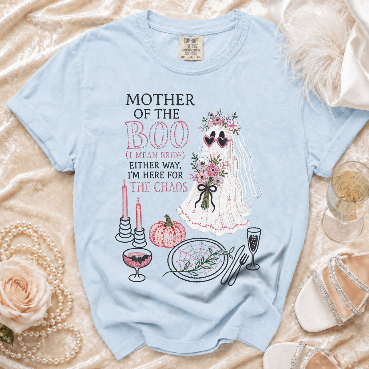 Light blue t-shirt with "Mother of the Boo (I mean Bride) Either Way, I'm Here for The Chaos" graphic.