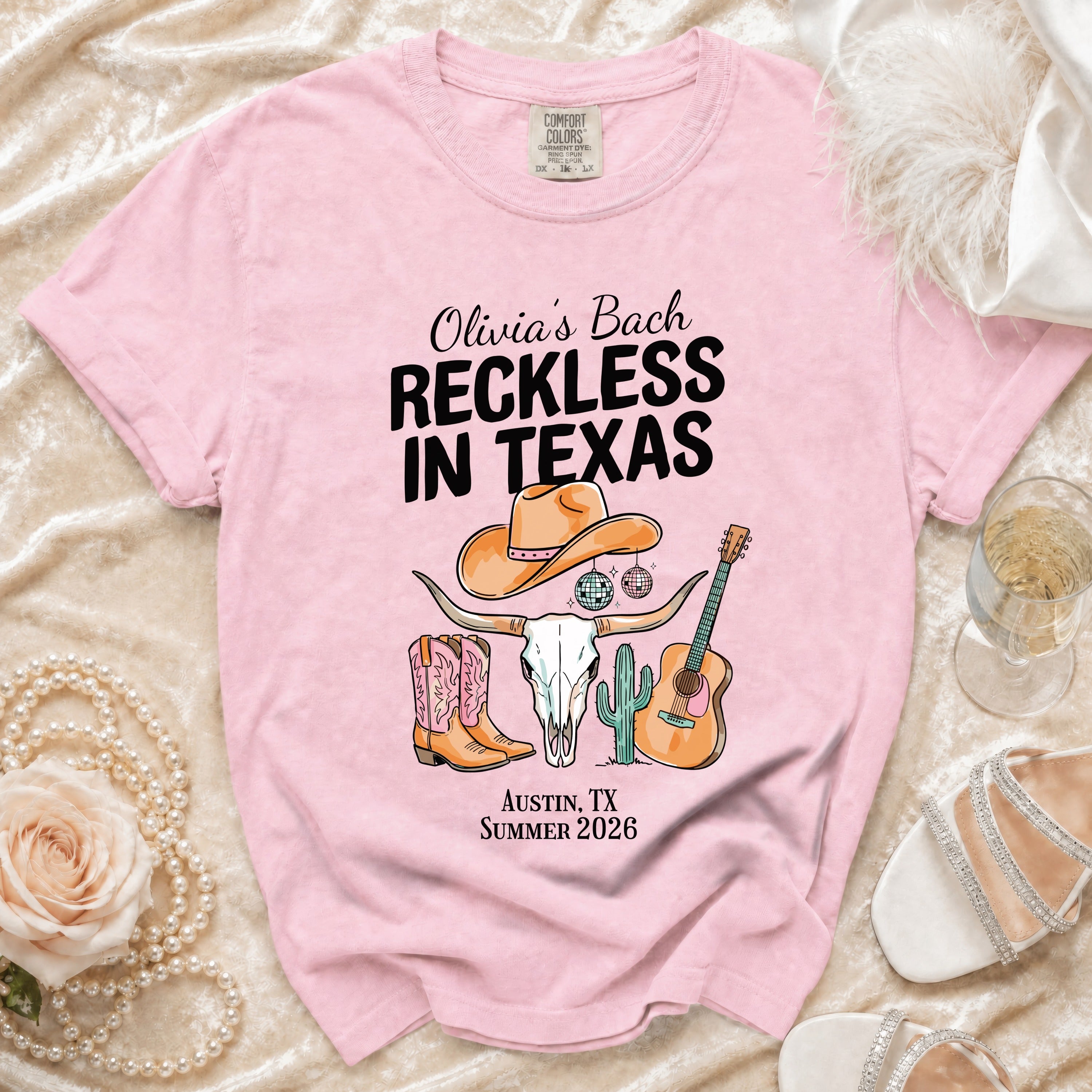 Pink t-shirt graphic with "Olivia's Bach Reckless in Texas" and Austin, TX Summer 2026.