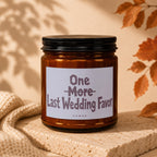 Amber candle with black lid, label reads "One More Last Wedding Favor VOWED".
