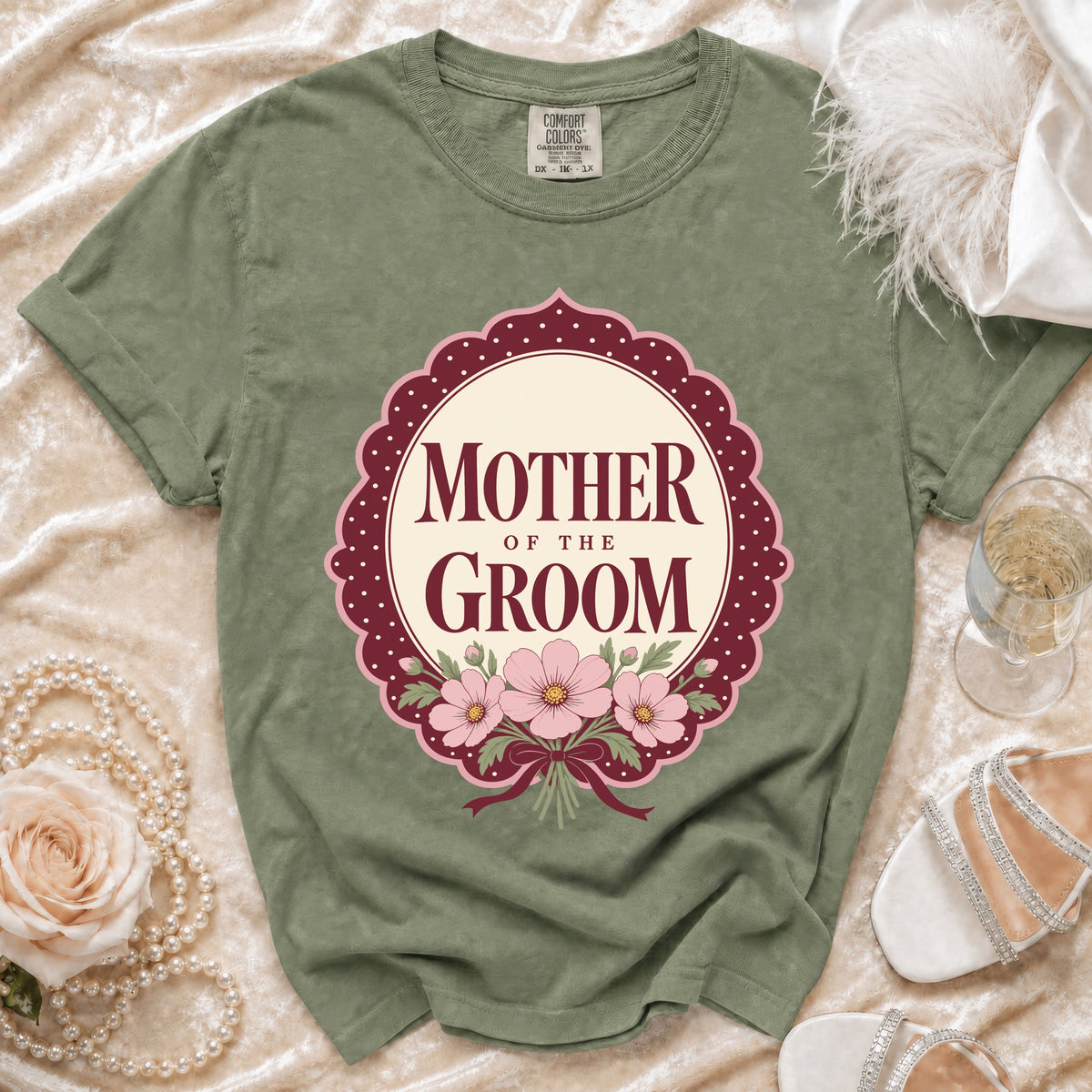 Green t-shirt with "Mother of the Groom" floral design in circular frame.