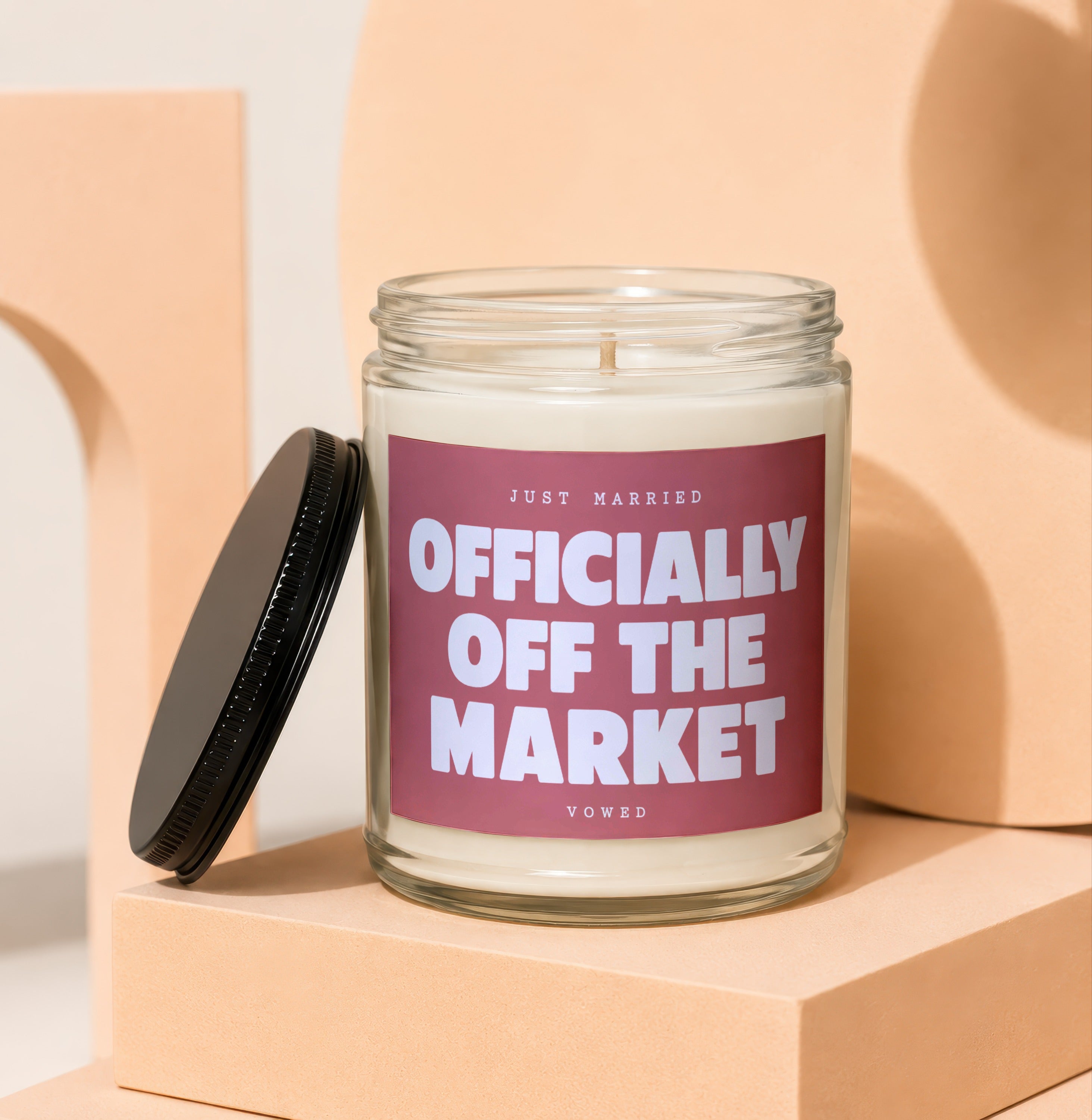 Candle with text "JUST MARRIED OFFICIALLY OFF THE MARKET VOWED".