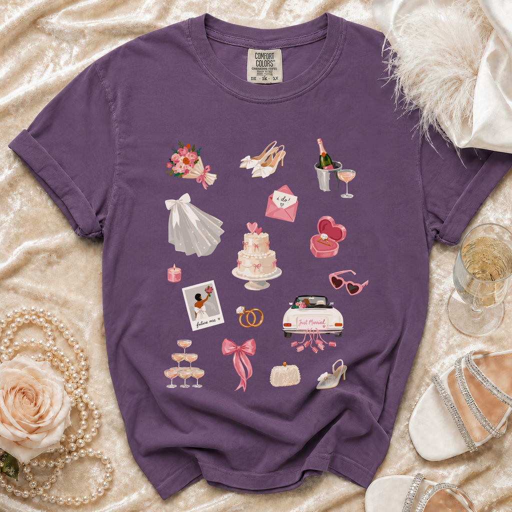 Purple t-shirt with wedding-themed graphics including a cake, rings, and "Just Married" car.