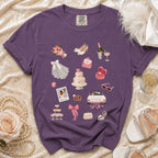 Purple t-shirt with wedding-themed graphics including a cake, rings, and "Just Married" car.