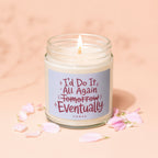 Glass jar candle with burning wick, surrounded by pink petals, reads "I'd Do It All Again Tomorrow Eventually".