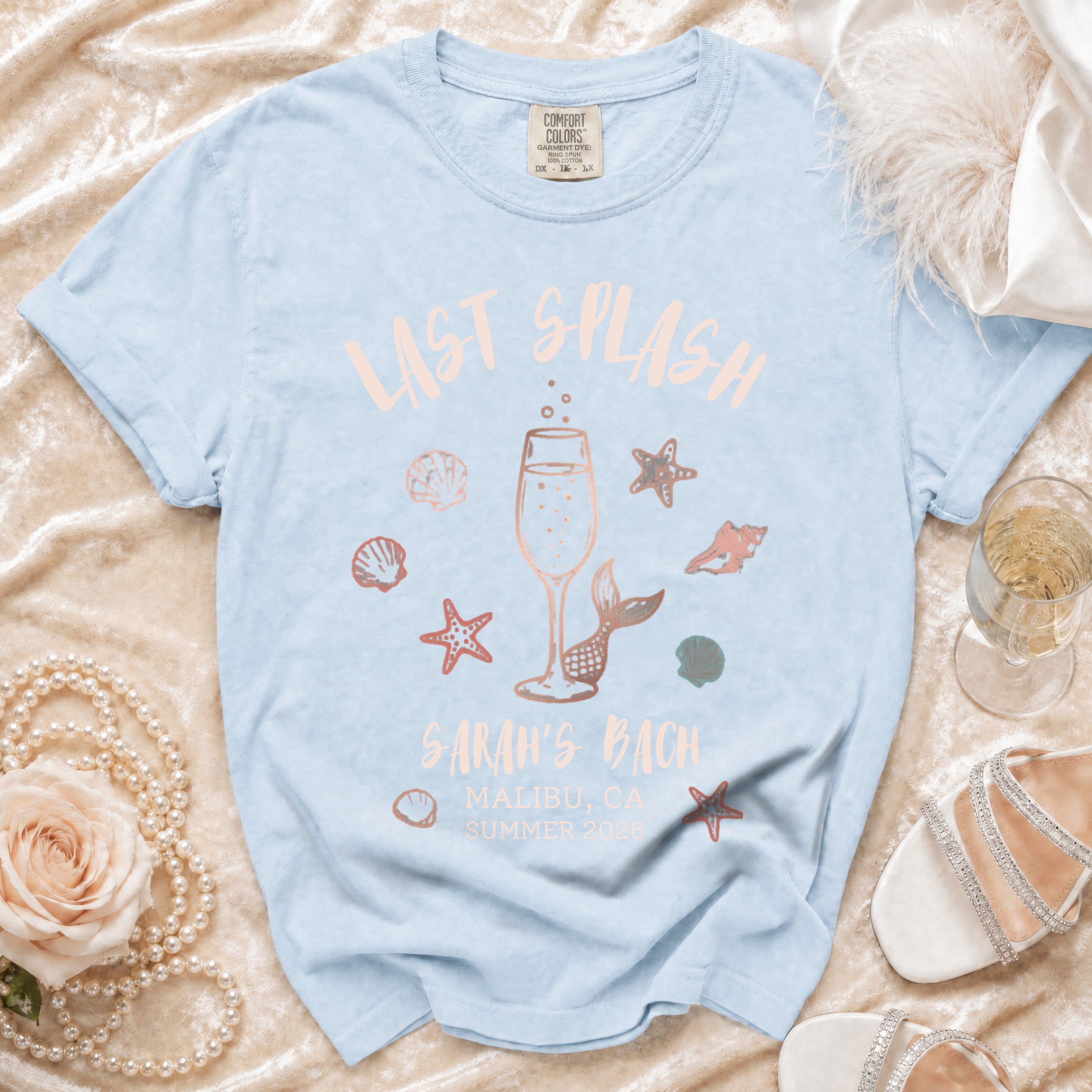 Light blue t-shirt with "Last Splash Sarah's Bach Malibu CA Summer 2026" text.