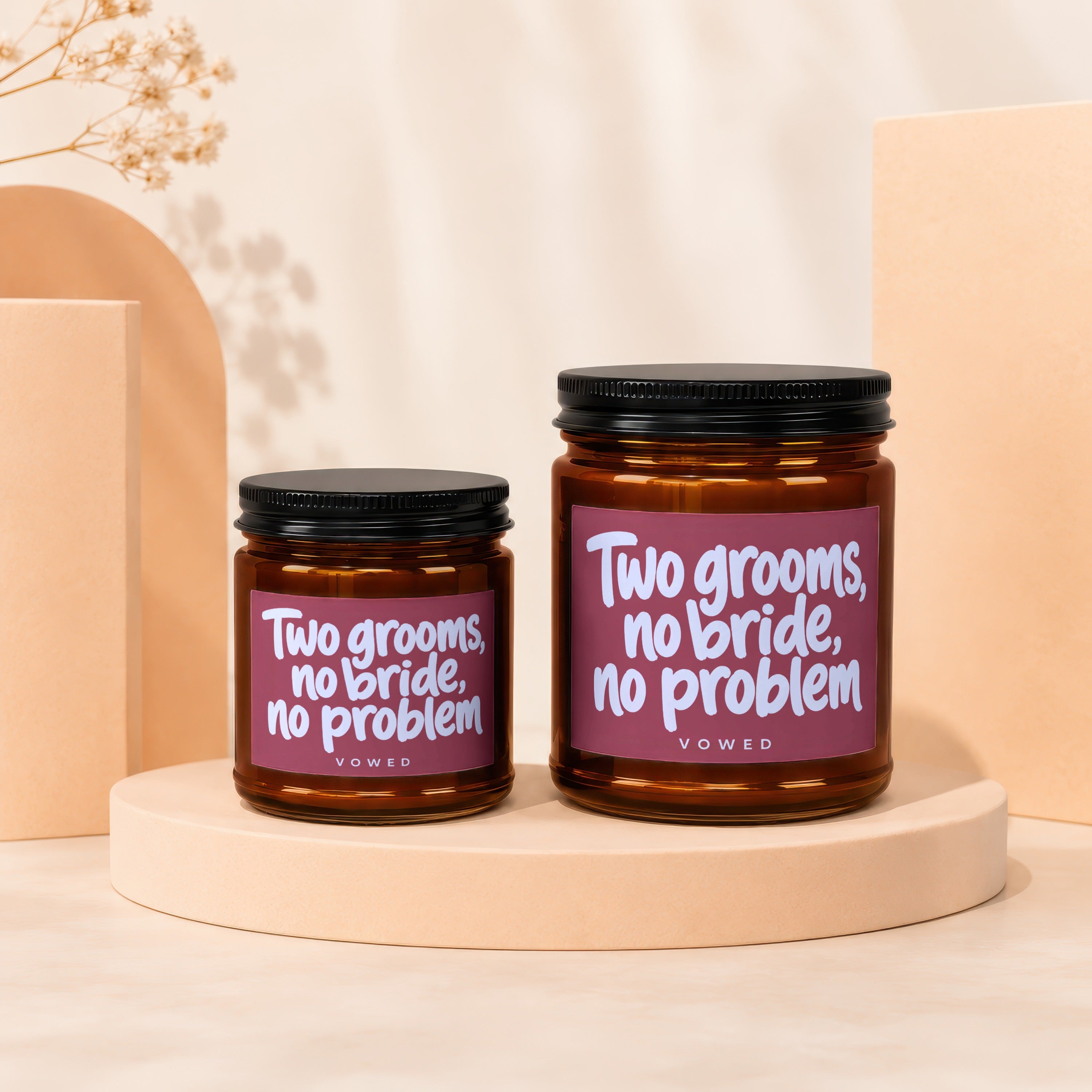 Two amber jars with black lids, both labeled "Two grooms, no bride, no problem."