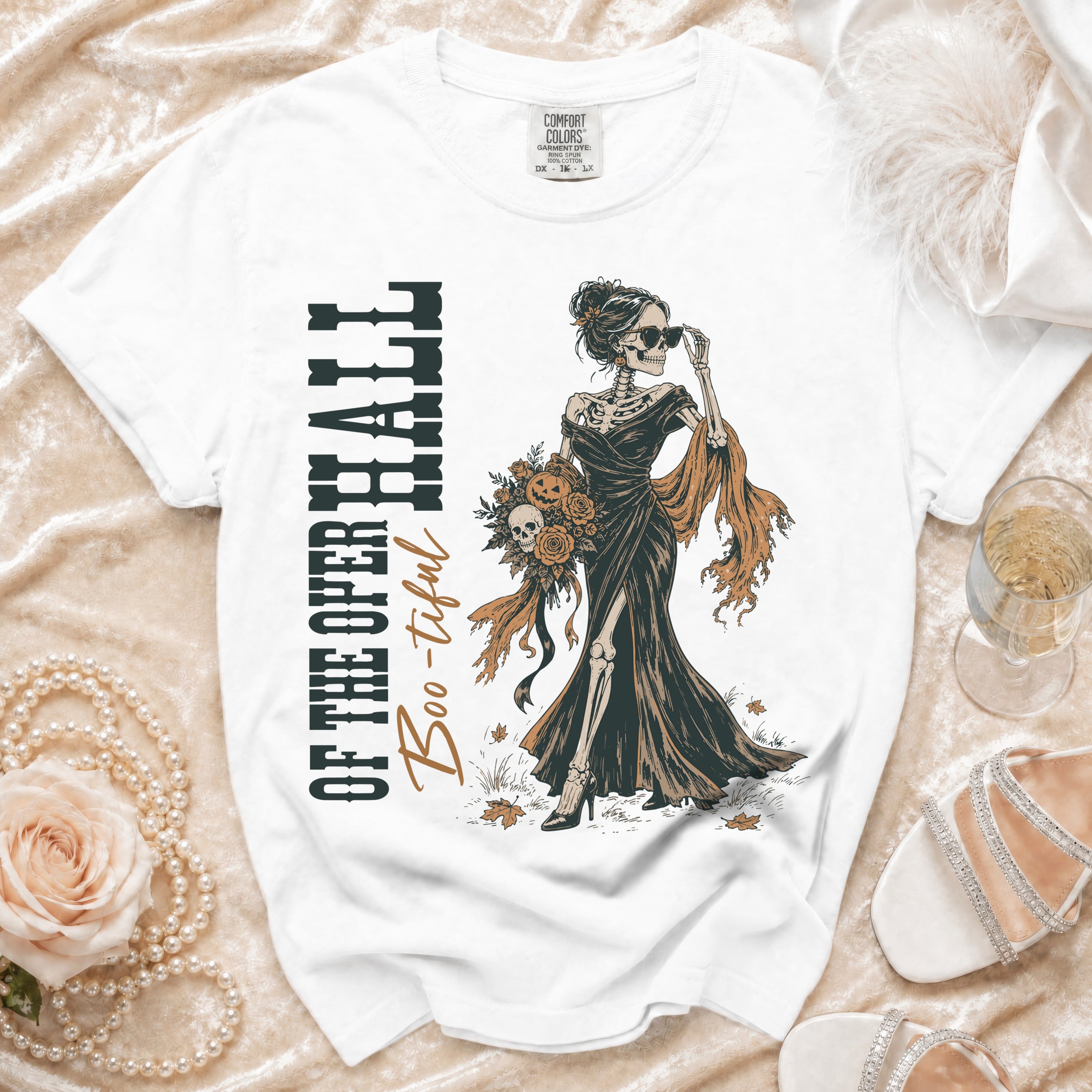 White t-shirt with skeleton graphic and text "OF THE OPER HALL Boo-tiful".