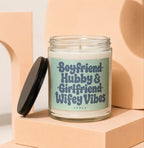 Jar candle with green label that reads "Boyfriend Hubby & Girlfriend Wifey Vibes VOWED."