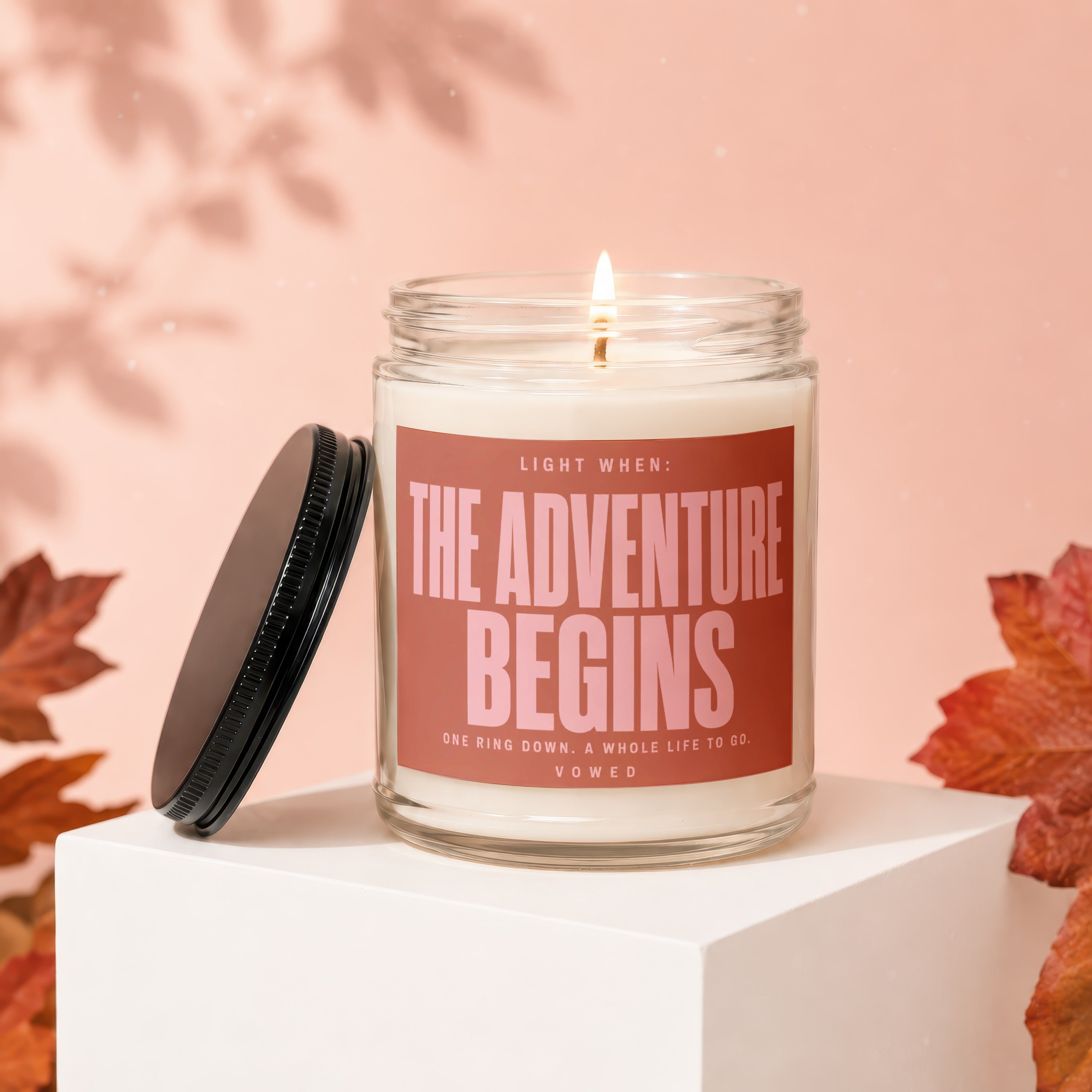 Candle with label: The Adventure Begins, One Ring Down, A Whole Life To Go, Vowed.