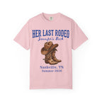 Pink t-shirt with "Her Last Rodeo Jennifer's Back" and cowboy boots.