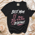 Black t-shirt with "BEST MOM MOTHER OF THE BRIDE BY DEFAULT" text.