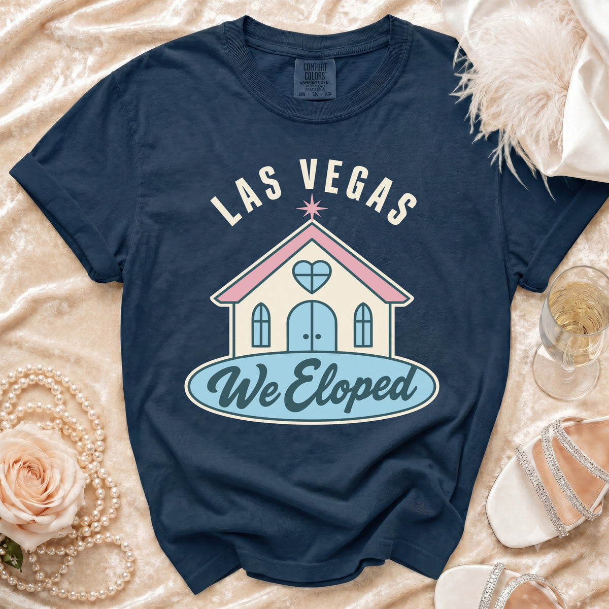Navy t-shirt with "Las Vegas We Eloped" text and wedding chapel graphic.