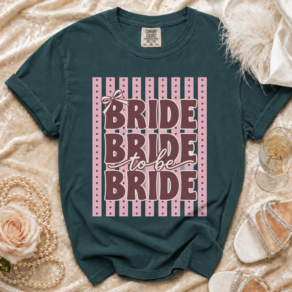 Dark teal Comfort Colors t-shirt with "Bride to be Bride" text and pink stripes.